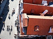 People Walking On Cobblestone Streets Next To Buildings, Aerial View