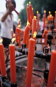 Man Lighting Incense Candles At Big Wild Goose Pagoda