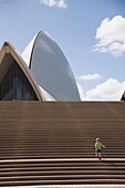 Young Boy Ascending Stairs Outside Sydney Opera House