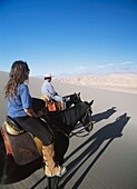 Couple Horse Riding In Valle De La Muerte