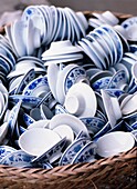 Lids & Saucers Of Tea Cups In Straw Basket In Tea House, Bamboo Park