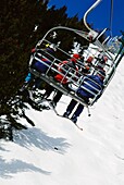 Skiers Going Up Chairlift, Alberta, Canada