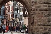 Street Scene Under Archway In Riquenwihr