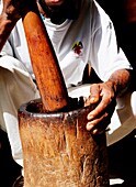 Man Crushing With Mortar And Pestle