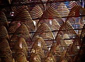 Large Coils Of Incense Hanging From The Ceiling Of Man Mo Temple