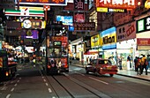 Busy Night Street Scene With Neon Signs