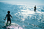 Children Playing In The Sea