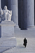 Man Climbing Steps That Lead To Supreme Court