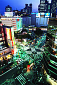 Shinjuku Station And Busy Street Scene At Dusk, High Angle View