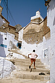 Boy Climbing Stone Steps