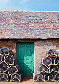 Cottage With Lobster Pots Outside