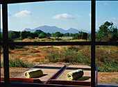 Two Sunloungers And Rural Landscape As Seen From A Window