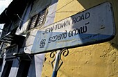 Jew Town Road Sign Outside Buildings In Cochin