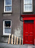 Hurling Sticks Outside Doorway Of House, Close Up