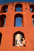 Tourist Reading Guide Book In The Jantar Mantar Observatory