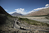 Lorry Driving Along A Winding Road In The Mountains