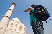 Woman With Rucksack Photographing The Taj Mahal, Low Angle View