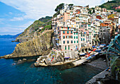 View Of The Village Of Riomaggiore Built Over A Cliff.