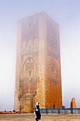 Woman Walking In Front Of Hassan Mosque