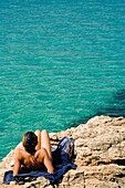 Woman Sunbathing At Blue Lagoon