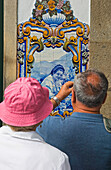 Couple Photographing A Quinta Panel At The Railway Station At Pinhao