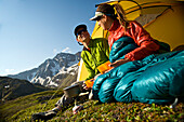 Hikers Enjoy A Morning Meal At Camp On The Williwaw Lakes Trail In Chugach State Park Near Anchorage,Southcentral Alaska, Summer