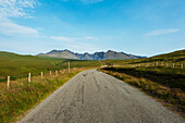 Looking Along The Road Between Carbost And Glen Brittle Towards The Black Cuillin; Isle Of Skye, Scotland