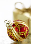 Red Christmas Ornament On A Frosted Background; Montreal, Quebec, Canada