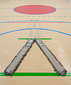 Sports and exercise facilities indoors. Gym. Sports Hall Cleaning equipment. A large divided floor sweeper or duster.