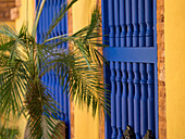 Cuba, Trinidad, UNESCO World Heritage Site, blue shutters in courtyard of Casa Particular, Spanish style colonial home. (PR)