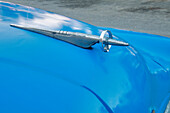 Detail of hood ornament on blue classic American Buick car in Habana, Havana, Cuba.