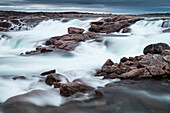 Canada, Nunavut Territory, Blurred image of rushing waterfall near Bury Cove along Hudson Bay, 100 miles south of the Arctic Circle (Large format sizes available)