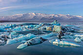 Calving icebergs in Jokulsarlon Glacier Lagoon in south Iceland