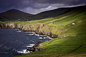 Evening sunlight over the countryside and coastline of the Dingle Peninsula, County Kerry, Ireland