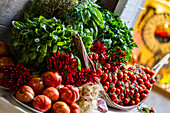 Venice, Italy. Bundle of Fresh Herbs, red Picante Peppers, onions, and tomatoes