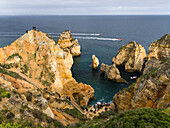 The cliffs and sea stacks of Ponta da Piedade at the rocky coast of the Algarve in Portugal.