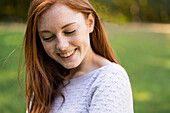 Portrait of smiling young woman in park