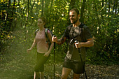 Couple trekking in forest