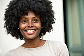 Portrait of smiling young woman in park