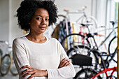 Mid-shot portrait of female African-American bicycle shop owner