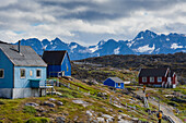 Greenland, Itilleq. Visitors exploring town.