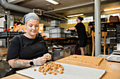 Disabled woman working in food factory