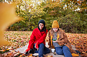 Happy friends in autumn scenery