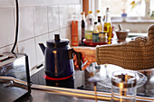 Woman preparing coffee in kitchen