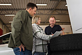 Customers in car dealership office