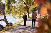 Man and woman walking in autumn park