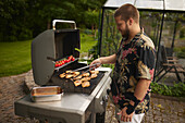 Man preparing food on barbecue