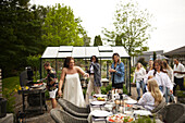 Friends having meal in garden