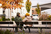 Man and woman sitting on bench