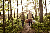 Couple walking through forest